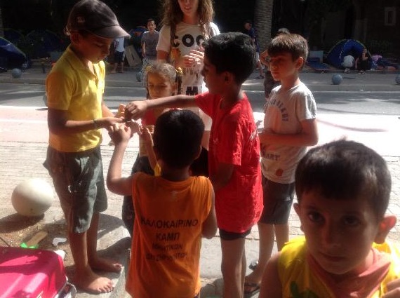 Syrian children sharing chocolate